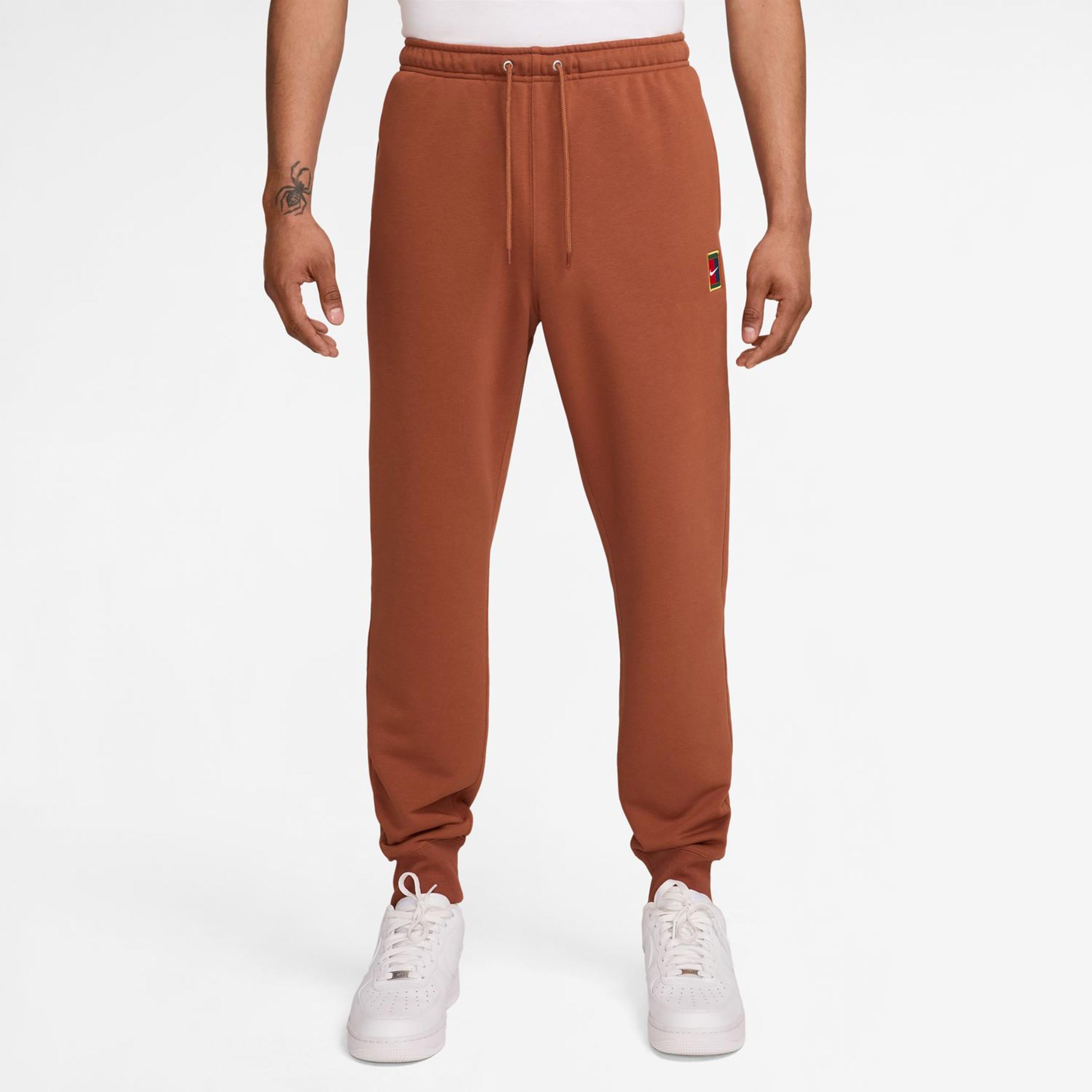 Nike Court Dri-Fit Heritage Fleece Trainingshose Herren-Rost